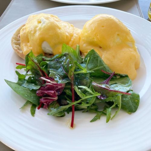 Eggs benedict with poached eggs, ham, hollandaise, English muffin, side salad.  Athens GR  @hotelgra