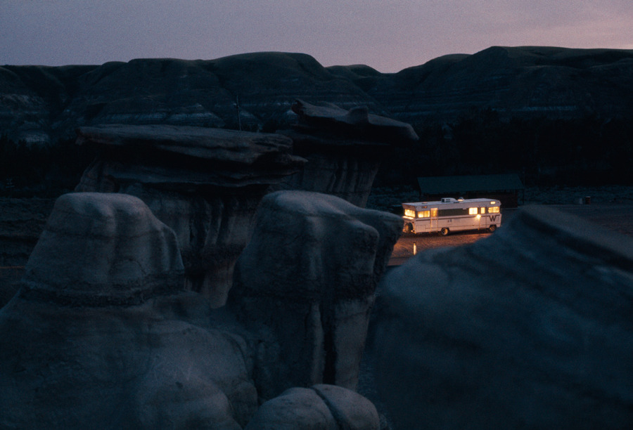 natgeofound:  A mobile home shines amid eerie rock formations in Alberta, Canada,