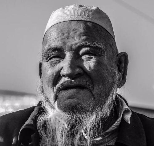 Portraits of ethnic Tajik, Kazakh, Russian, Uyghur, and Kyrgyz men in various hats in Xinjiang.Photo