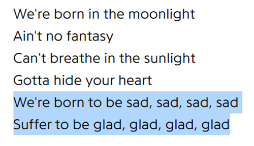 Lyrics from the song "moonchild" by RM in black text that read, “We’re born in the moonlight / Ain’t no fantasy / Can’t breathe in the sunlight / Gotta hide your heart / We’re born to be sad, sad, sad, sad / Suffer to be glad, glad, glad, glad” The last two lines are highlighted in pale blue.