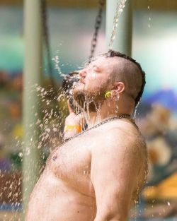 thepupupthere:   @pupdozor the other staff photographer for Drenched Fur, taking a brief break and enjoying a cool, brisk waterfall at Splash Lagoon Waterpark during the main event in Saturday night.   http://www.DrenchedFur.com   #Bear #Cub #BearRun