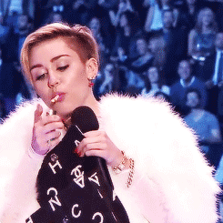  Miley Cyrus smoking a blunt while receiving an award at the EMAs     