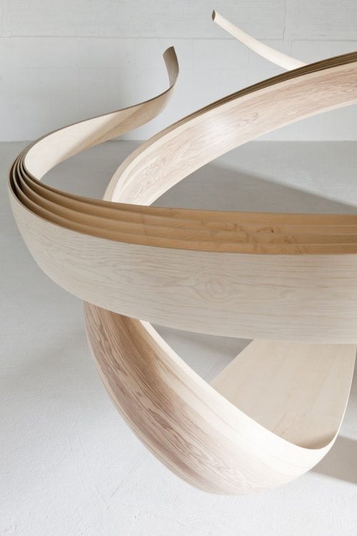 Magnus Celestii is a natural wooden desk that spirals up to the ceiling. Designed by Joseph Wal