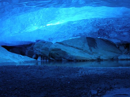 NIGARDSBREEN ICE CAVE, NORWAYThe photo shows a glacier pond in the glacier cave underneath the Nigar