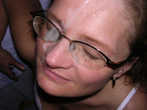 Wifey with glasses smiles after a nice facial cumshot