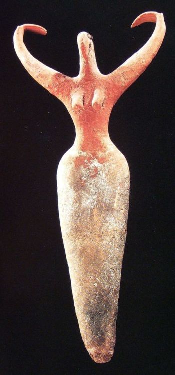 Female Figurine with Incurving ArmsPottery figurine of a woman. Small head, with beak-like face, on 