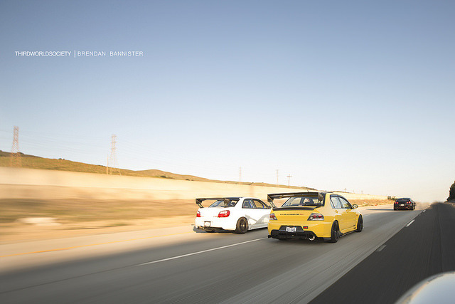 wealthymindsdivision:  Evo and Sti with Voltex Wing Cruising on Flickr. 