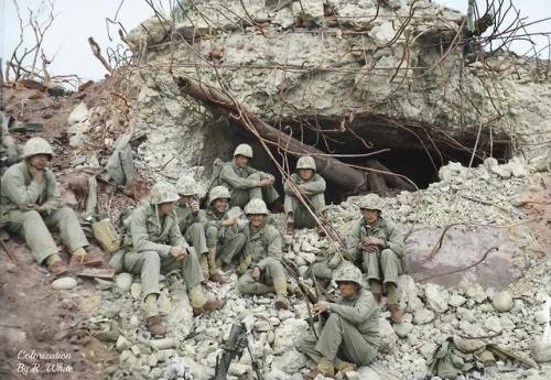 historicaltimes: Battle hardened United States Marines rest for a moment in front of a blown out Jap