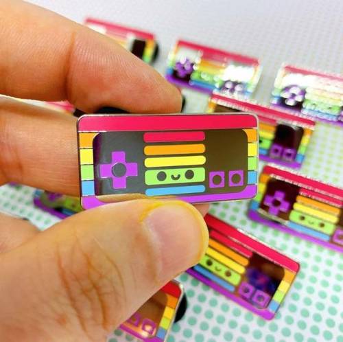 wind-up-key:retrogamingblog:LGBT+ Flag Nintendo System Pins made by Jessica Kellogg-KuhnI love 