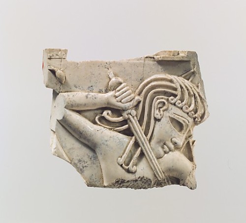 buonfresco:Plaque fragment with the upper torso of a youth thrusting a sword, c. 9th-8th century B.C