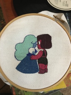 kappatastic:  My latest cross stitch…thing. Ruby and sapphire WIP maybe help me pick a good quote for the background?