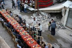 troposphera:  People gather for Iftar (breaking fast), organised by Adaleh Foundation,  amidst damaged buildings during the holy month of Ramadan in the rebel  held besieged Douma neighbourhood of Damascus, Syria. REUTERS/Bassam  Khabieh