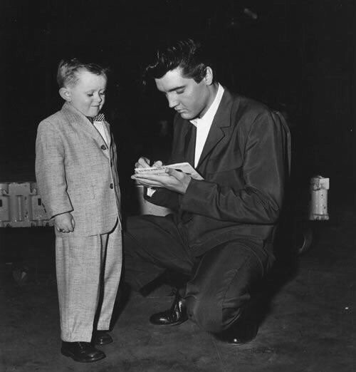 Elvis signing an autograph