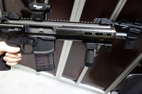 45-9mm-5-56mm:  awesomeness2:  thedepthcharger:  Sig Sauer MCX. It is operated by a dual short stroke piston gas tappet system with the recoil spring assembly in the upper, so no buffer tube is needed. There will be an integral suppressor available,