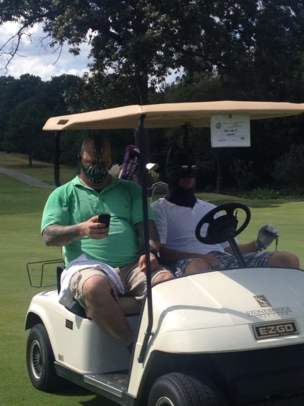 dorkly:  Bane and Batman: Golf Buddies You think the sand trap is your ally?