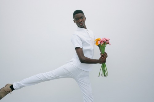 dynamicafrica:  In Conversation with Brandon Stanciell - The Man Who Loves Flowers.One of the first-ever photographs I came across involving a black man tenderly clutching flowers and gazing into  the lens of the camera was a self-portrait by Cameroonian