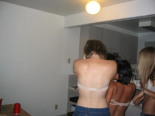 A wonderful embarrassed strip beer pong game, with a large group of cute girls getting down to their