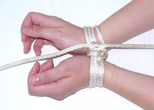 subnancy:dare-master:Modern Classic Tie Step 1  -  Start with standard length of rope (about 6-7 feet for wrists). Form a Lark’s Head. Step 2  -  Place the Lark’s Head over the wrists. Step 3  -  You now have a small measure of control