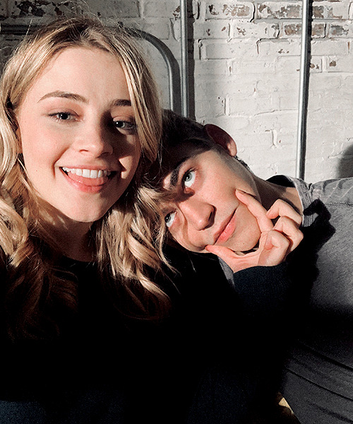 I smile and lean into Hardin as he snaps our picture.  “One more” he instructs