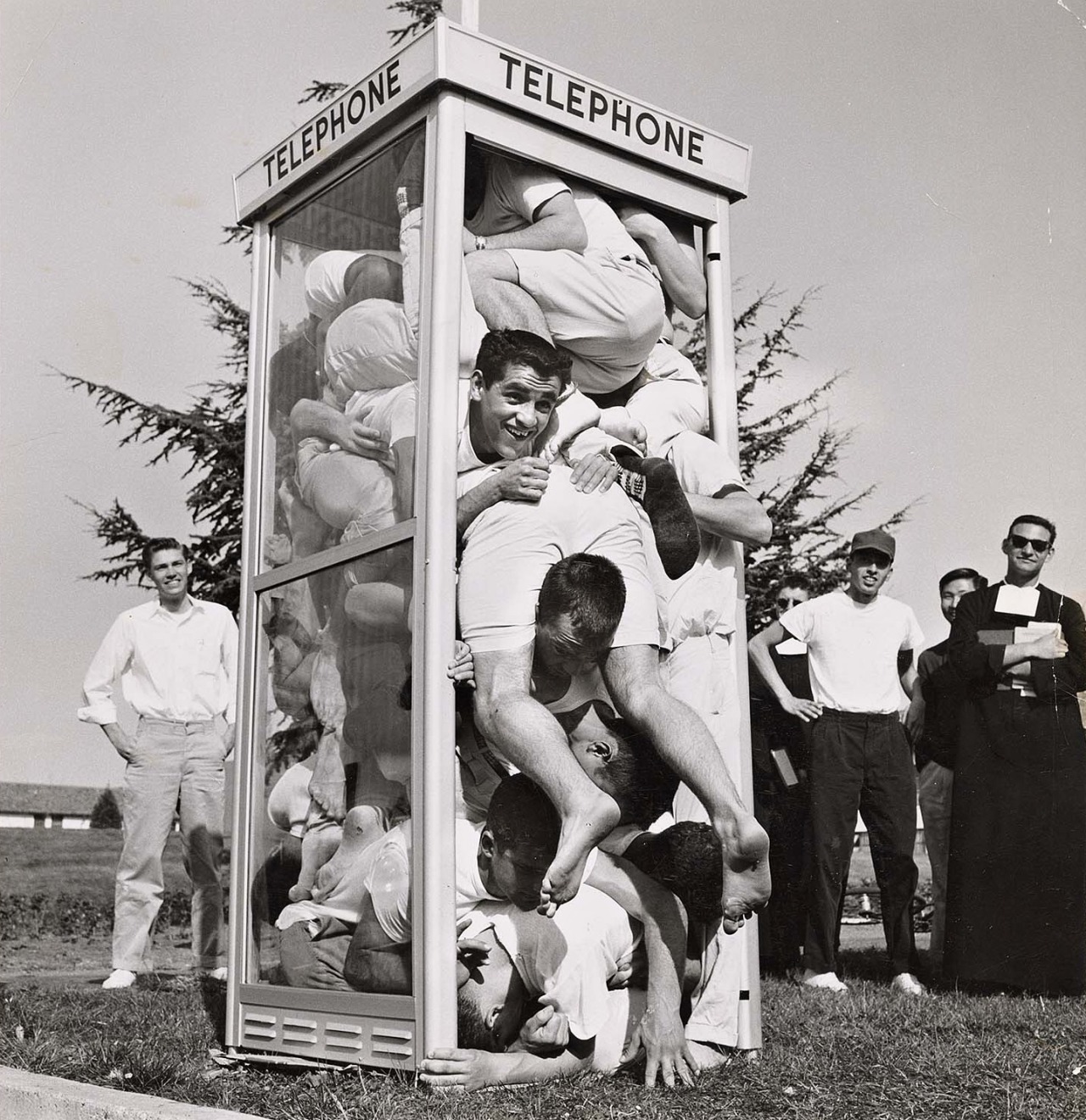 Joe Munroe - Twenty-two students cramming into a telephone booth to try and establish