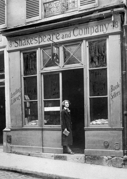 thedevineone: American publisher Sylvia Beach stands in the doorway of her bookshop “Shakespea