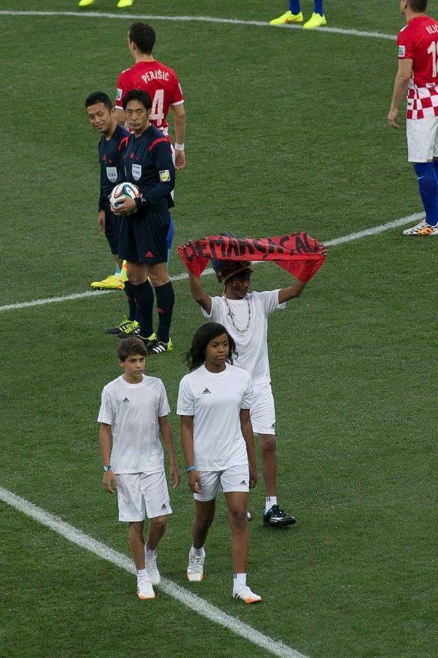 rebelfootball:
“ At last night’s opening ceremony of the World Cup, three children (presumedly representing Brazil’s “racial democracy”) released three white doves in an act symbolizing peace and harmony. But what the cameras didn’t show (because...