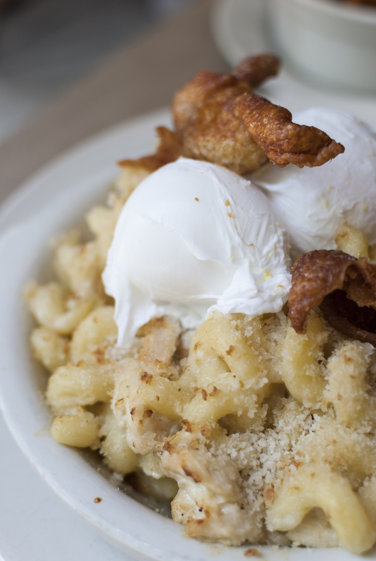 The Nose Dive Macaroni and Cheese: cavatappi pasta with white cheddar, hand-pulled chicken, poached eggs, and crispy chicken skin.
Personally, I like my mac and cheese creamier, baked into a dish like a cheesy, carby casserole. But the crispy chicken...