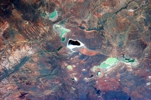 The cloudless heat of the Australian Outback evaporates lakes into many colours.