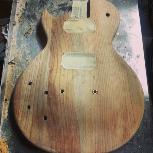 Finally made it down to the bare wood. Still plugging away on this Epiphone LP100 refinish. I think 