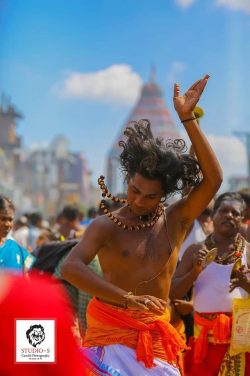 Devotees dance during the great carriage festival at the Shiva Nataraja temple in Chidambaram, Tamil