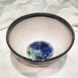 I put glass marbles in the bottom of a few bowls, just to see what type of design it would create. The outside is pretty basic, but I&rsquo;m nonetheless pleased with the outcome of the melted marbles :) #pottery #clay #ceramics