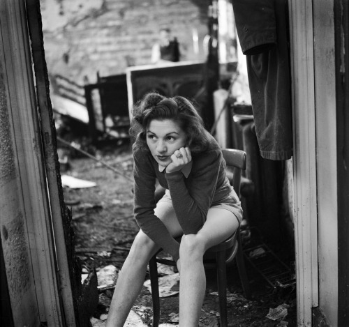 A dancer working on a revue in wartime Britain rests in a bombed out dressing room, October 1940 | G