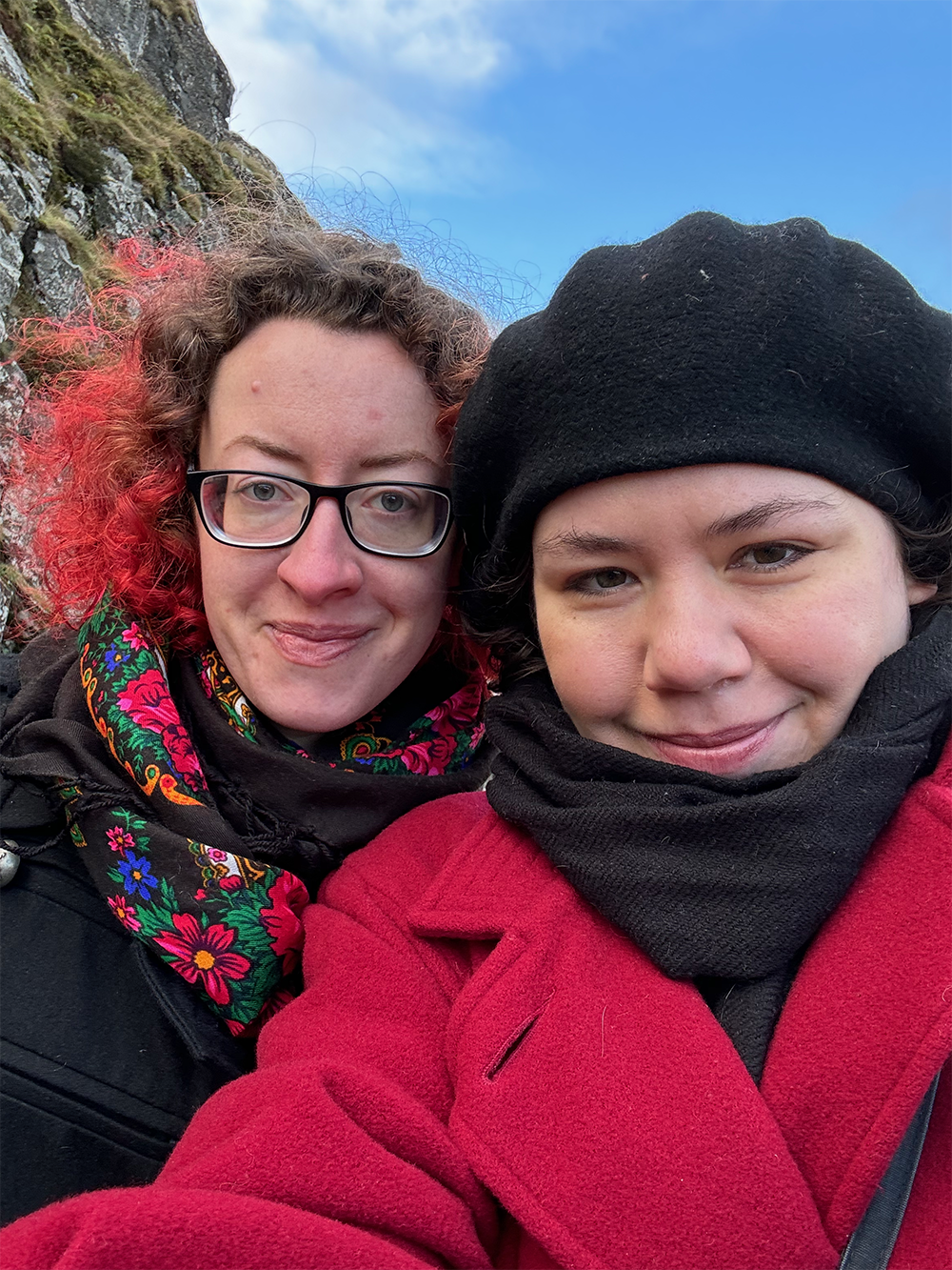 Selfie of Elizabeth and Gav bundled up in red and black, respectively.