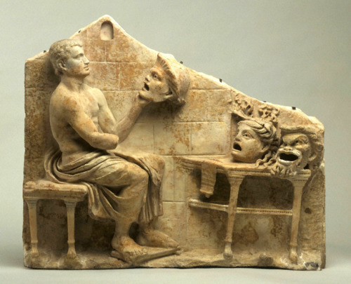 lionofchaeronea:Roman marble relief showing the Greek playwright Menander, with masks representing t