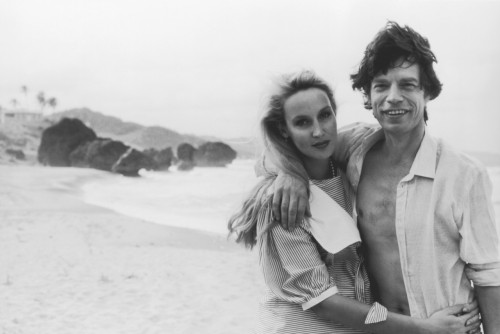 70rgasm: Jerry Hall and Mick Jagger on the beach at Barbados, by Wally McNamee, 1983