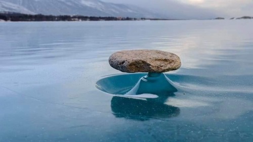 thisobscuredesireforbeauty: “Baikal Zen”: Rocks that have fallen on the ice of Lake Baikal are heate