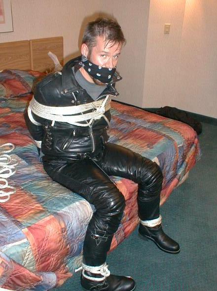 bubbabrando:  jhardcastle1976:  The best way to keep a guy in a leather biker jacket, tied up and his big mouth gagged  yes, it was quite effective. 