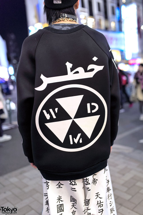 Yana on the street in Harajuku wearing a DAMAGE neoprene top, Buccal Cone kanji print pants, YRU pla