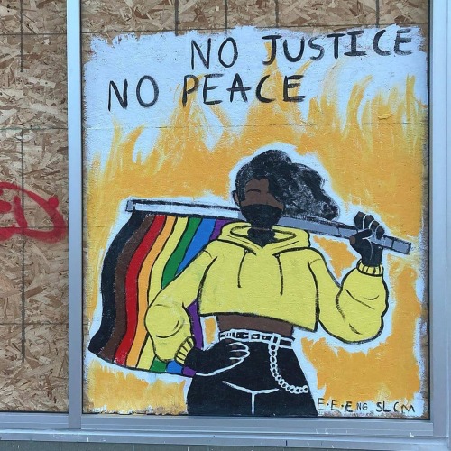 “No Justice, No Peace” Mural on a boarded-up shopfront in Madison, Wisconsin
