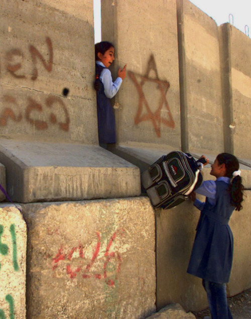 imransuleiman: Two Palestinian schoolgirls going to school through the Israeli Apartheid Wall.