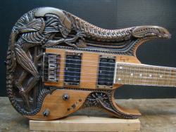 amplifiedparts:  These are all beautifully crafted one of a kind hand carved guitars done by the very talented Gig Goldstein. I am a HUGE fan of H.R. Giger and even have one of his pieces tattooed as a sleeve on my leg from my knee to my ankle so I am