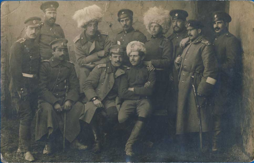A group of Bulgarian officers posing with captured Russian Cossack hats - Papakhi/Astrakhan. The pho