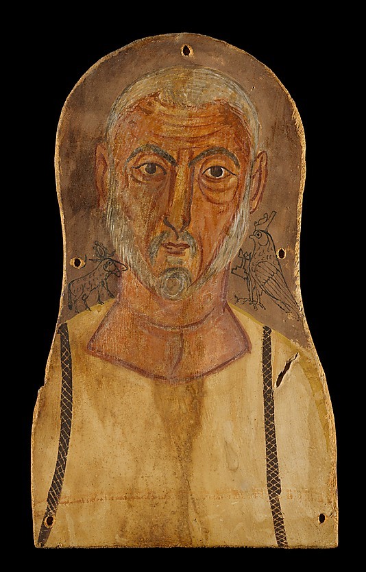 ancientpeoples:
“ Portrait of an elderly man
Portrait is made on sycomore wood. Material used is tempera. The man is flanked by Egyptian gods; on the right the god Horus and on the left the goddess Hathor. 38 cm high and 22.4cm wide ( 14 15/16 x 8...