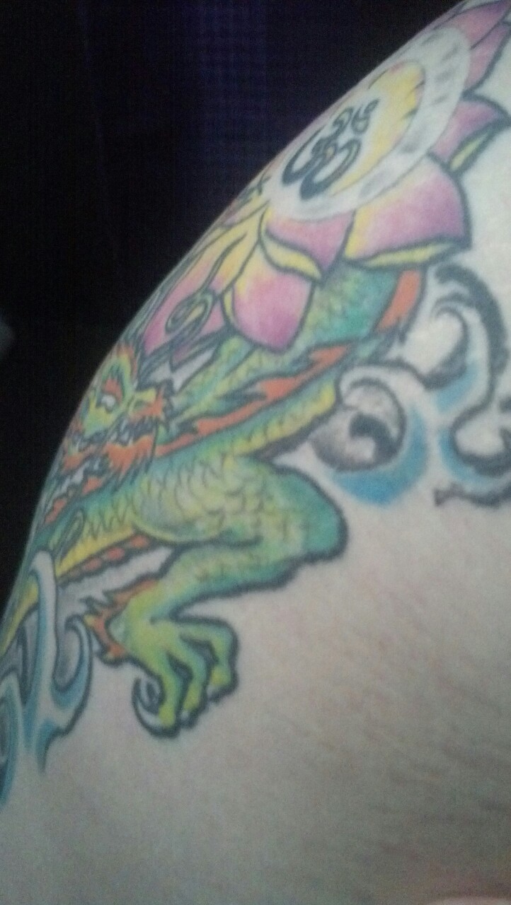 acidkittiegoddess:  Downtown morning light on my side tattoo. My skin in natural