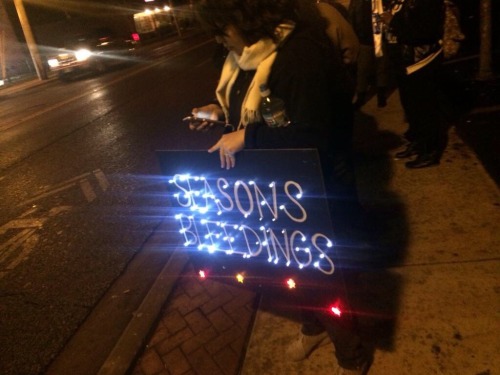 zubat:“Seasons bleedings” in Christmas lights at a demonstration in Ferguson, Missouri.