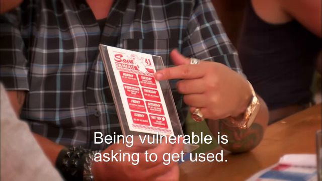 72% sure it's a man holding a piece of paper. Caption: Being vulnerable is asking to get used.