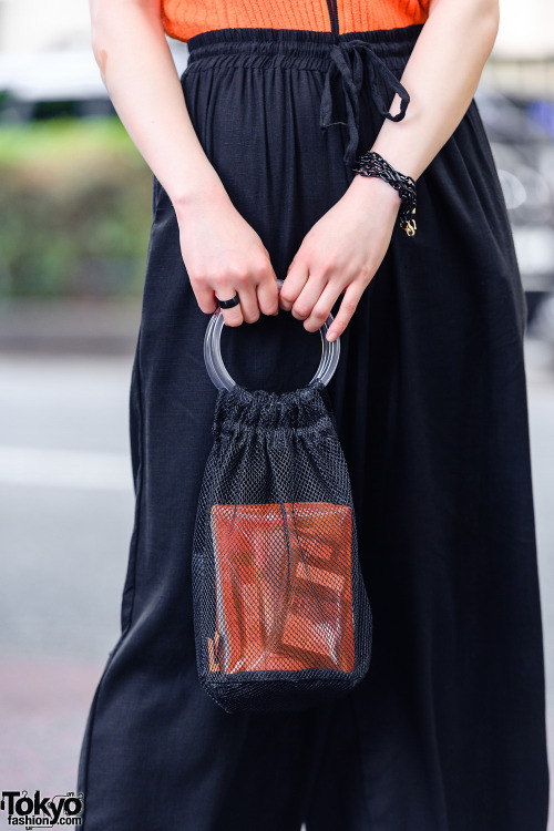 21-year-old freelancer Japanese model Saki on the street in Harajuku with an orange ribbed vintage t