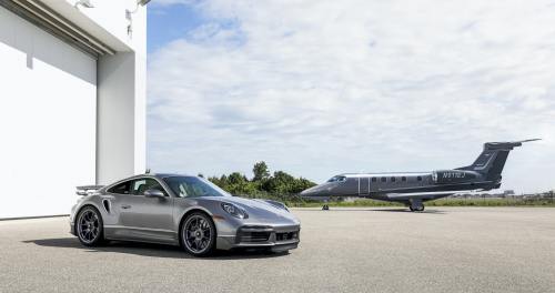 Porsche’s ‘Duet’Embraer Phenom 300E business jet and a Porsche 911 Turbo S vehicle