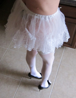 yoursissyfag:  sissyslut faggot plays in her pretty white lacy bra sheer tulle miniskirt ooops no panties lace top stockings and cum fuck me hard black high heels 