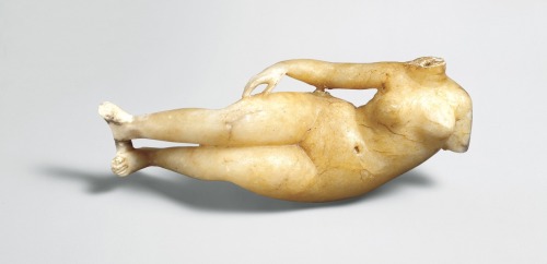 via-appia:Alabaster figure of a reclining woman. Reclining figures are common among Greek terracotta